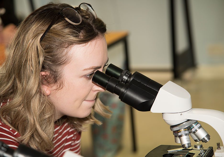 Abbeydale veterinary nurse student looking in microscope